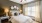 large bedroom with lots of natural lighting